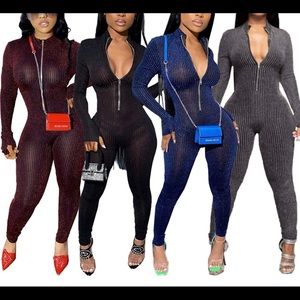 Jumpsuit is a shiny burgundy and black Shane Justin